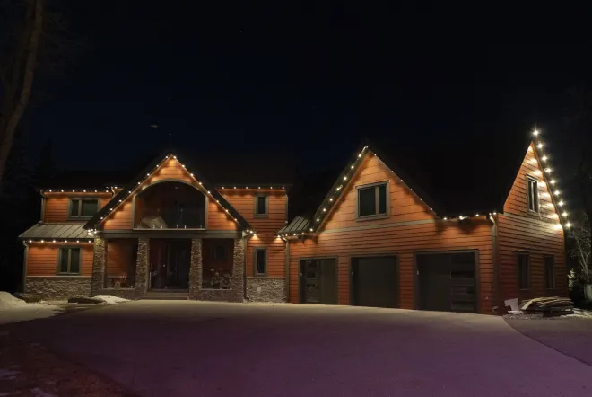 Permanent Gemstone Lights set to an architectural warm white pattern in East St. Paul, MB
