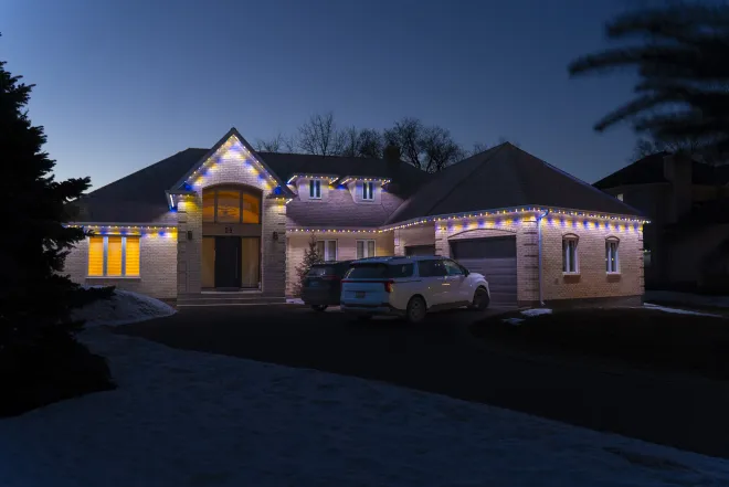 Gemstone Lights installed with a blue and yellow colour pattern in East St. Paul, MB