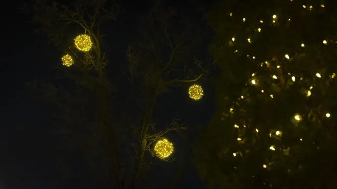 Warm white white &#039;Wrapped&#039; light spheres installed above with C6 lights in the foreground in Winnipeg, MB