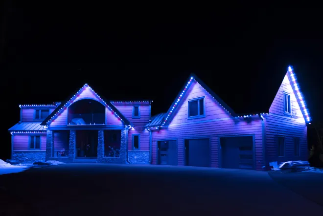 Permanent Gemstone Lights set to a blue and pink colour pattern in East St. Paul, MB